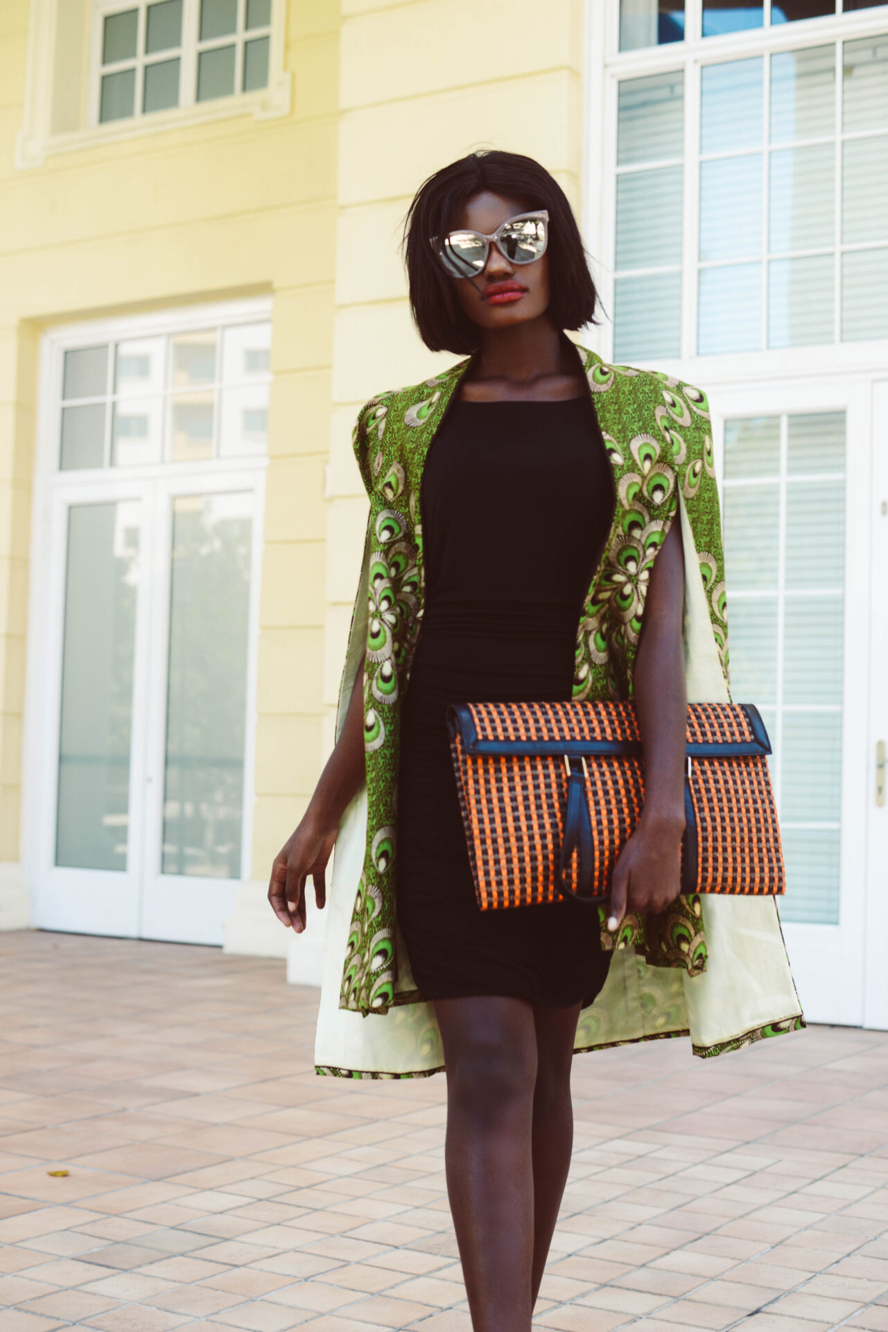 Statement cape mid-stride