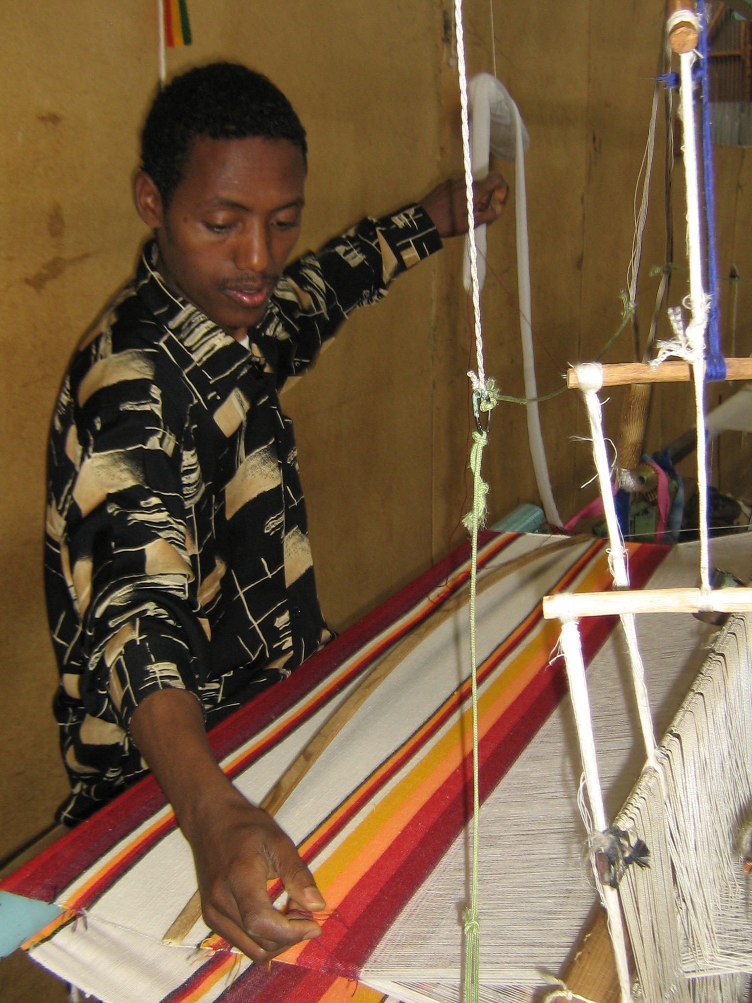 A weaver at a traditional Ethiopian loom